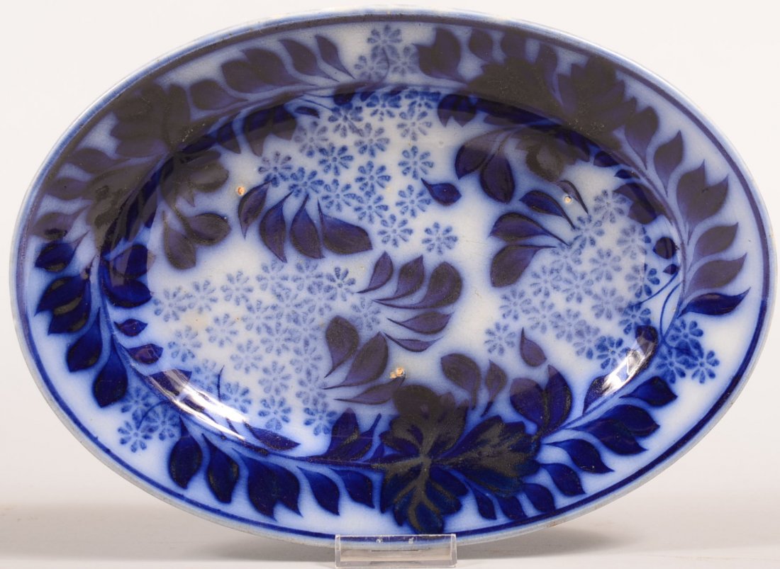Flow Blue Brush Stroke and Stick Spatter "Wild Asters": Flow Blue Brush Stroke and Stick Spatter "Wild Asters" Pattern Ironstone China Oval Platter. Impressed Baker & Co. 12-1/2"w. Condition: Good, no damage.