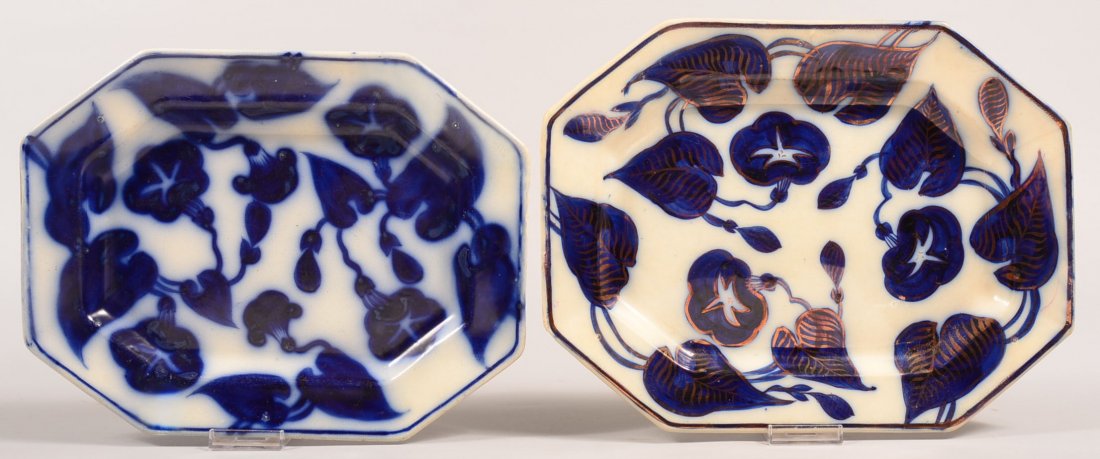 Two Flow Blue Brush Stroke "Morning Glory" Pattern: Two Flow Blue Brush Stroke "Morning Glory" Pattern Ironstone China Platters. 13-5/8"w. and 14-3/8"w. Condition: Smaller platter has a 2-1/2" hairline and edge chip repair, Larger platter has a flake c