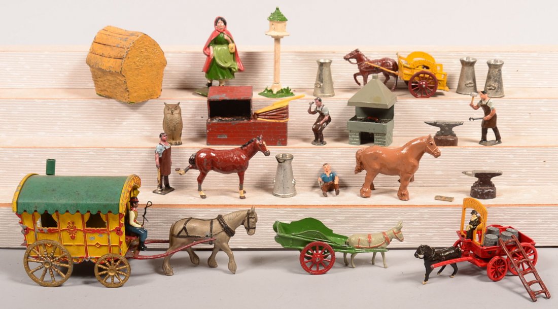 Grouping of Painted Cast Metal Figures. Including Eebee: Grouping of Painted Cast Metal Figures. Including Eebee Brewers dray, blacksmith by Taylor & sons and Hill & Co. Charbens horse drawn pure milk wagon, donkey and cart, gypsy wagon, 1" to 4"h. Conditio