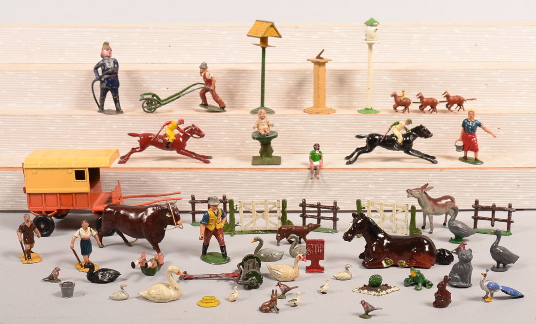 Grouping of Painted Cast Metal Figures. Including: Grouping of Painted Cast Metal Figures. Including Charben delivery van, Cherilea donkey and fence, Timpo farmer leading bull and various others, tallest 3-3/4"h. Condition: Good with use wear.