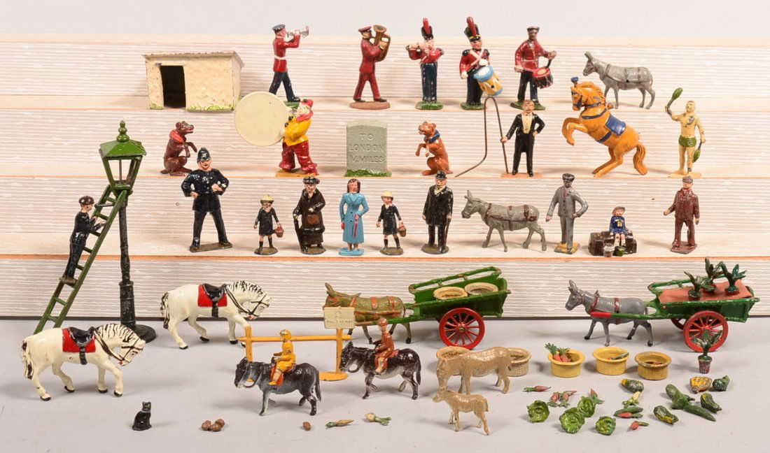 Grouping of Painted Cast Metal Figures. Including: Grouping of Painted Cast Metal Figures. Including Taylor & Barrett donkey ride, donkey with coaster cart, band figures, circus figures, lantern tallest 5-1/2"h. Condition: Good with use wear.
