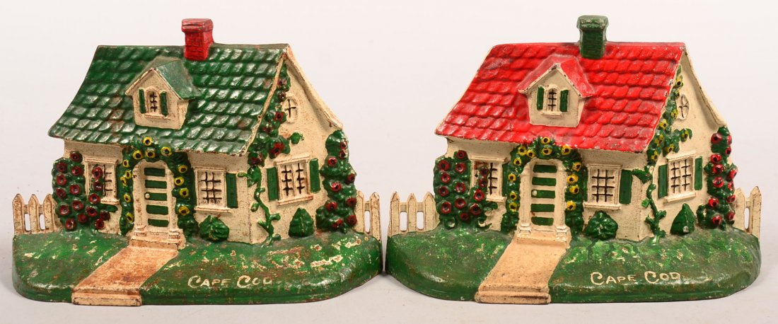 Two Painted Cast Iron Cape Cod Cottage Doorstops. Mold: Two Painted Cast Iron Cape Cod Cottage Doorstops. Mold # 32 by the Albany Foundry, 5-1/2"h. Condition: Good.