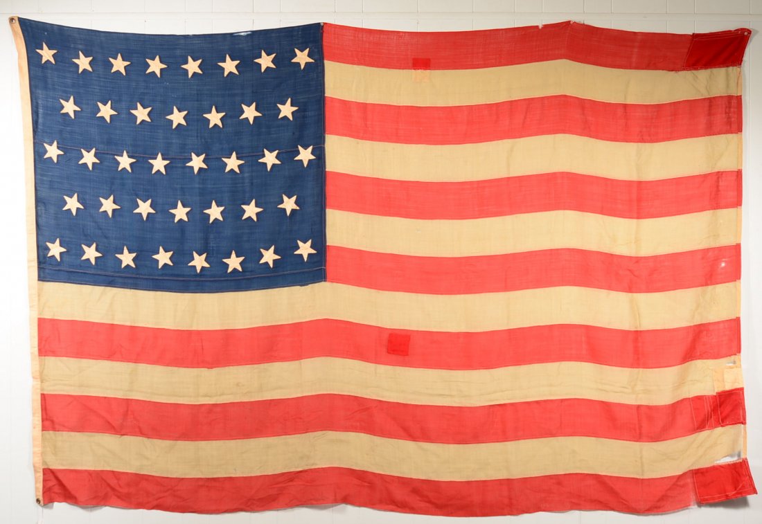 Large Thirty Eight Star American Flag. American flag: Large Thirty Eight Star American Flag. American flag with 38 hand sewn stars, 6' x 9' , Condition: Patch repairs and losses.
