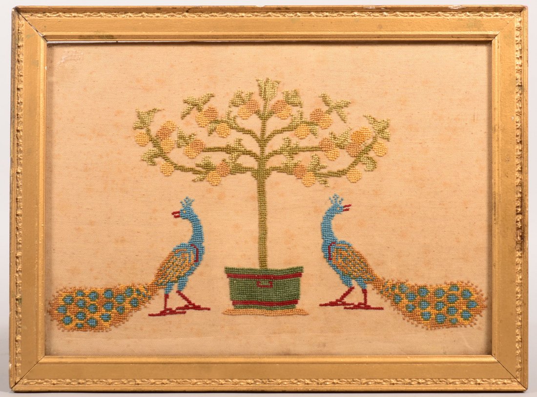 Framed Needlework of Potted Plant and Peafowls. In gold: Framed Needlework of Potted Plant and Peafowls. In gold painted frame, 17"h. x 22-3/4"w. Condition: Good with minor loss to frame.