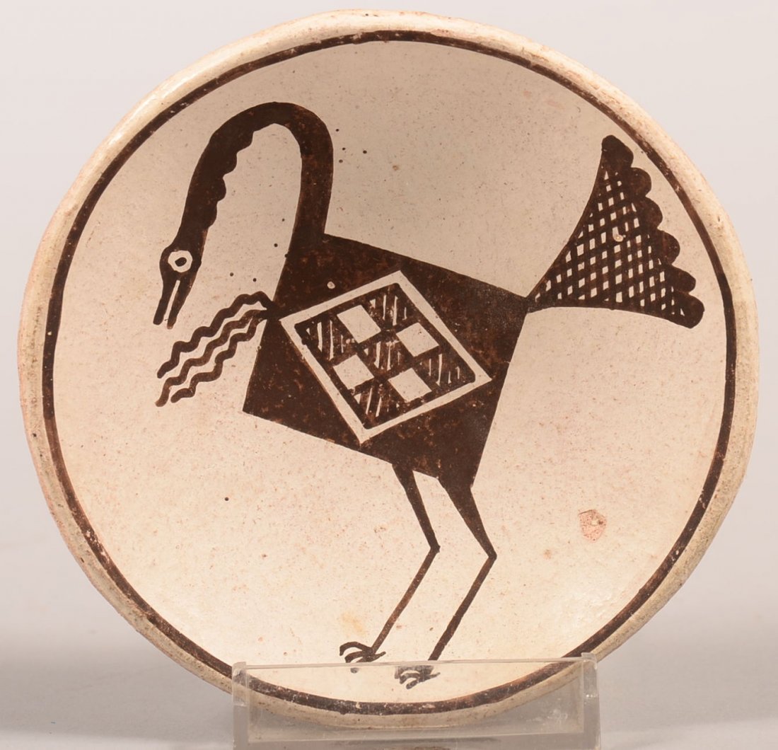 A desirable Acoma Pueblo clay dish decorated with a: A desirable Acoma Pueblo clay dish decorated with a Hohokam culture stylized bird design made by the celebrated Master Artisan Lucy M. Lewis - artist signed 4" dia. Good with minor blemish