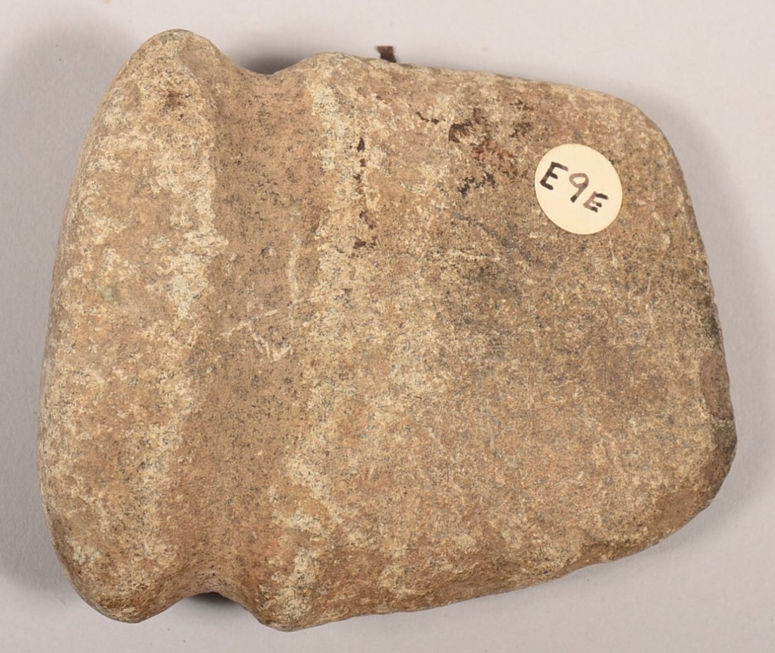 A small-sized ancient full grooved axe head.: A small-sized ancient full grooved axe head.