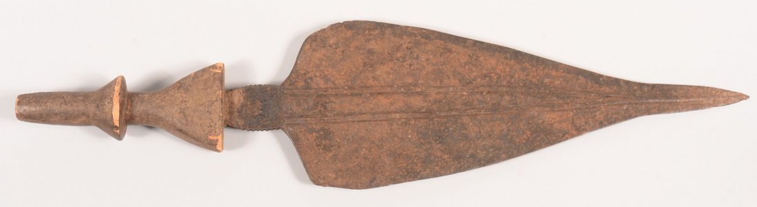 An old African knife 21" long with broad iron blade and: An old African knife 21" long with broad iron blade and carved wood haft
