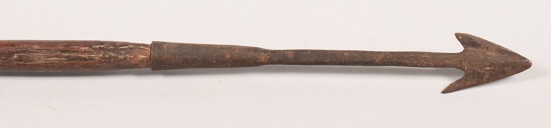 An antique African tribal spear with a barbed iron: An antique African tribal spear with a barbed iron point