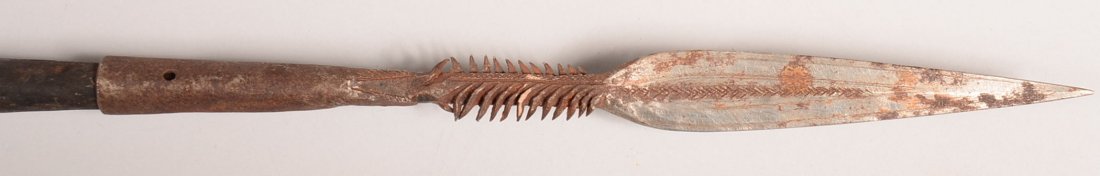 An African spear with wicked multibarbed point and: An African spear with wicked multibarbed point and metal wrapped shaft - Good
