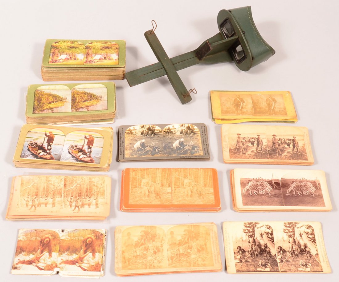 Lot of over (160) stereo cards depicting hunting and: Lot of over (160) stereo cards depicting hunting and fishing scenes from the late 1800's, early 1900's. Included is a stereo viewer. Condition: good to very good.