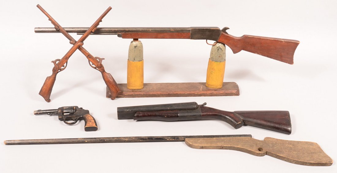 Group of five various carved wood folk art guns.: Group of five various carved wood folk art guns. Including a revolver, sawed off shotgun, two rifles and a pair of crossed half-stock percussion rifles. 10-1/2" to 46-3/4" long overall. Condition: goo