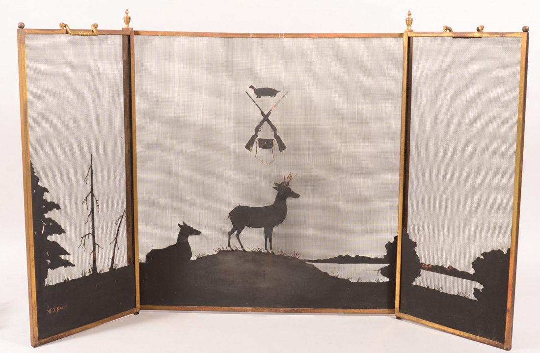 Brass frame fire screen signed "W.J. Bally" with: Brass frame fire screen signed "W.J. Bally" with silhouette of stag and cow with crossed guns, game bag and turtle design. 33" h. x 55"w. Condition: Good. Est. 100-300