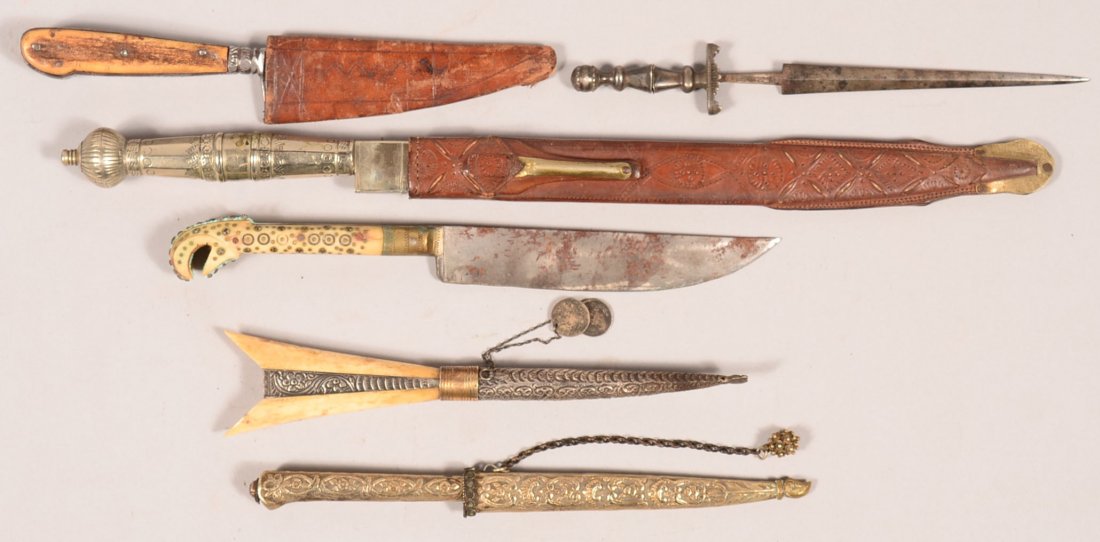 Lot of (6) well-made handmade knives and daggers: 1). a: Lot of (6) well-made handmade knives and daggers: 1). a silver mounted Gaucho knife; 2). Middle Eastern silver mounted Damascene knife; 3). ivory handle silver mounted Burmese knife having (2) English