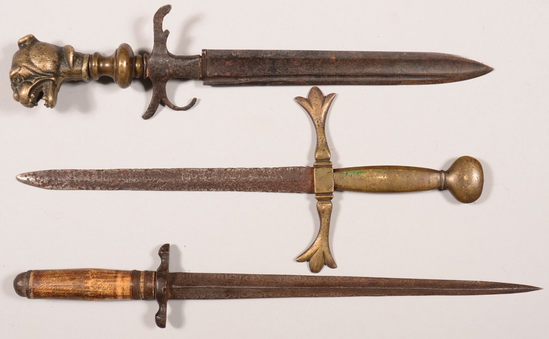 Lot of (3) interesting daggers: (2) with early European: Lot of (3) interesting daggers: (2) with early European blades and Victorian era mountings together with a Middle Eastern bone handled dagger. 14-1/2" to 16-1/2" overall. Condition: fair to very good.