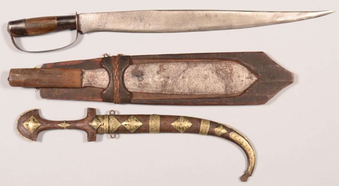Lot of (3) vintage fighting knives: Moro cutlass,: Lot of (3) vintage fighting knives: Moro cutlass, Philippine tribal knife, and Arabian dagger. Condition: good.