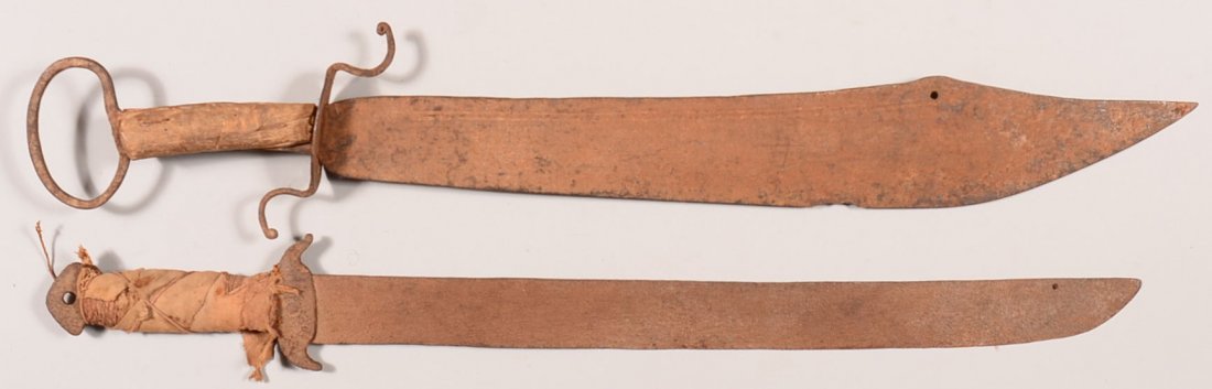 Lot of (2) antique Spanish colonial hand forged: Lot of (2) antique Spanish colonial hand forged machete-like swords: 21-1/2" and 23" blades. Condition: Rusty.