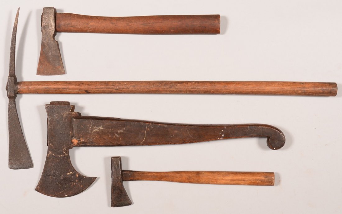 Lot of (4) early handheld axes: (2) European with: Lot of (4) early handheld axes: (2) European with flared bits; an early spike axe; and a belt axe. 11" to 22-1/2" overall. Condition: good.