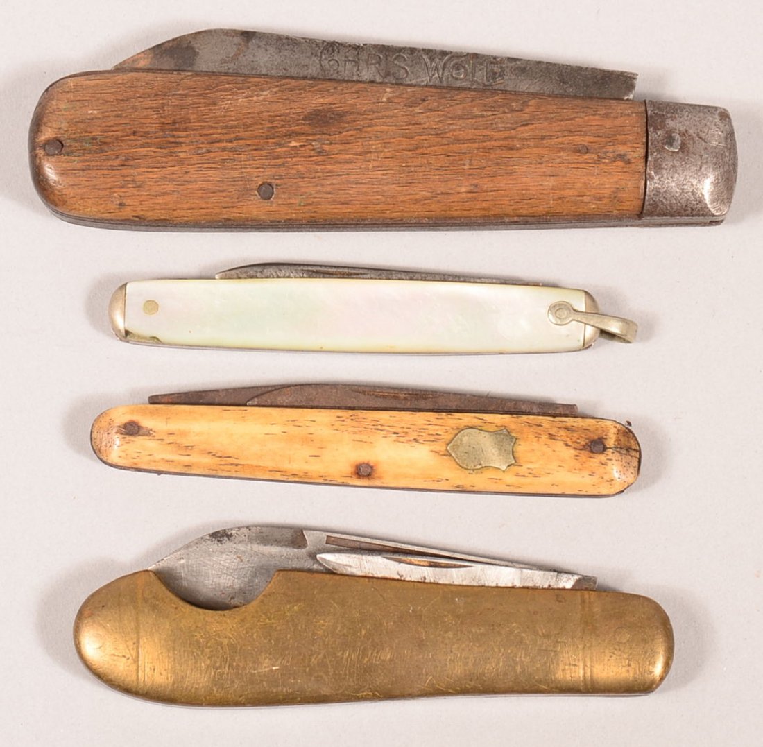 Lot of (4) folders: a 3" CHRIS WOLF with wood grips; a: Lot of (4) folders: a 3" CHRIS WOLF with wood grips; a double bladed 2-1/2" Remington with brass grips; a double bladed 2" with bone grips; and a 1-7/8" with pearl grips. Condition: good.