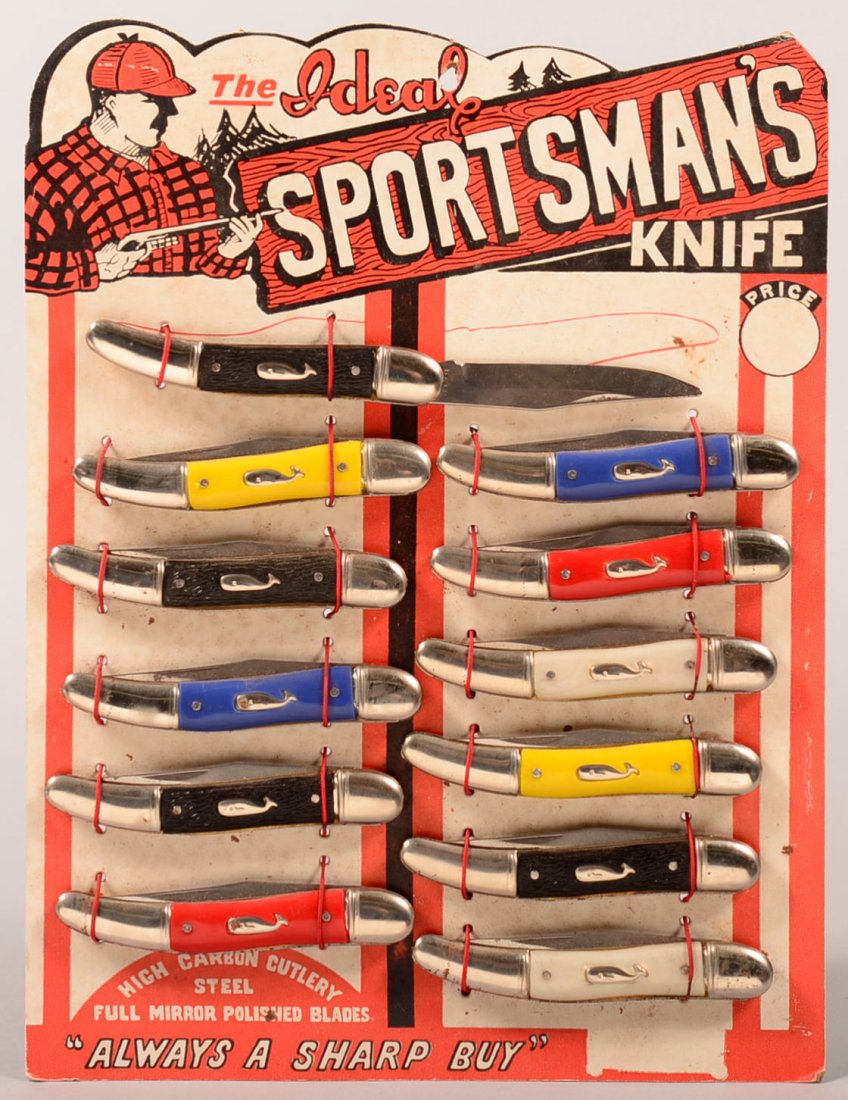 Ideal Sportsman's knife advertising display with (12): Ideal Sportsman's knife advertising display with (12) folding knives mounted on a die cut cardboard having a hole at the top for suspension. The unit comes in a protective Riker mount. Condition: exce