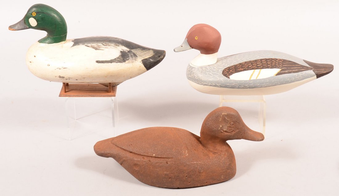 Decoy lot of (3): "Horace Graham, Charlestown, MD" with: Decoy lot of (3): "Horace Graham, Charlestown, MD" with paint crack around neck; Chesapeake Bay Golden Eye "MVW"; metal sink box decoy. Condition: good to fine