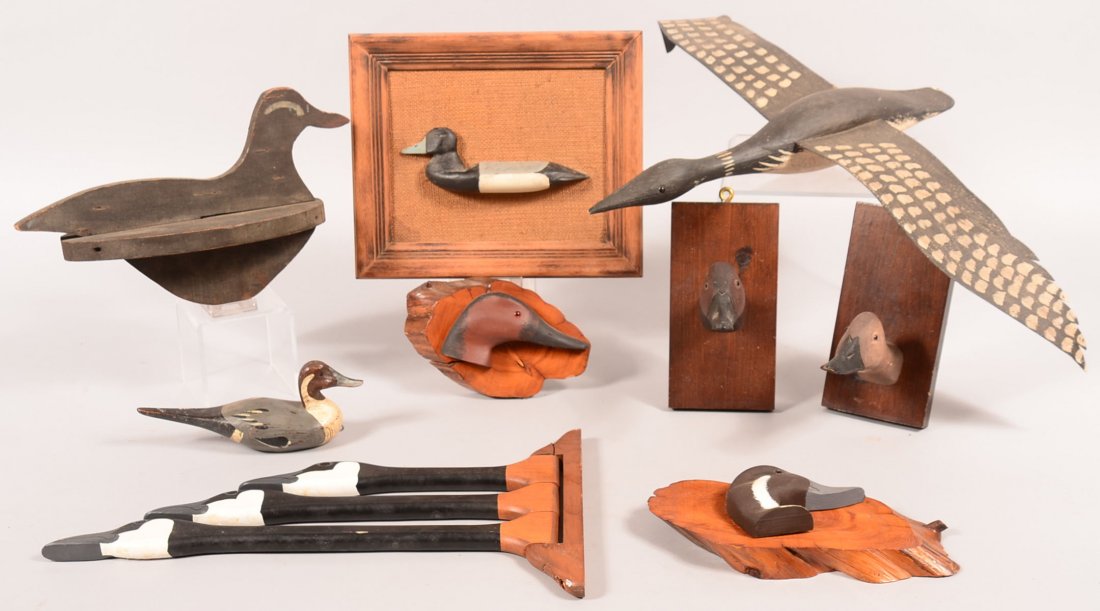 Decoy lot of (9): Pair of Canvasback duckhead plaques;: Decoy lot of (9): Pair of Canvasback duckhead plaques; Pintail and Canvasback "R.VanBrunt 1978; Fly Loon with metal wings stamped "RAM 98"; mini pintail "BBD"; primitive duck decoy; goose towel bar; B