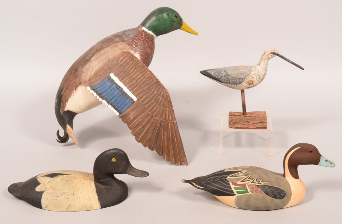 Decoy lot of (4): Drake Mallard-hand carved wood with: Decoy lot of (4): Drake Mallard-hand carved wood with wings set for landing; wood carved shorebird, "Stoney Point Decoys, VA 1983" tail broken; metal Bluebill. Condition: fine to excellent.