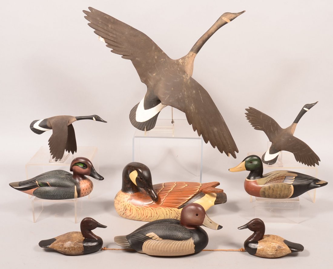 Decoy lot of (9): (3) flying Canada goose wall plaque: Decoy lot of (9): (3) flying Canada goose wall plaque "D. Stavely, Eastern MD 1990"; pair of mini Canvasback "RLW"; 4 Boyds Collection decoys. Condition: fine to excellent