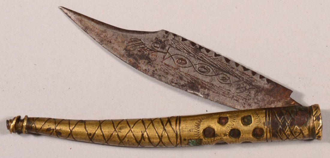 Engraved Spanish Navaja folding knife having a brass gr: Engraved Spanish Navaja folding knife having a brass grip and 3-1/8" blade. Condition: very good.