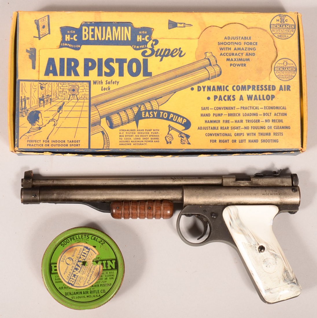 Benjamin High Compression model 132 lever action 22: Benjamin High Compression model 132 lever action 22 caliber air pistol sn B-87640, with white grips, in its original box with Benjamin pellets and literature. Condition: the barrel and cylinder are st