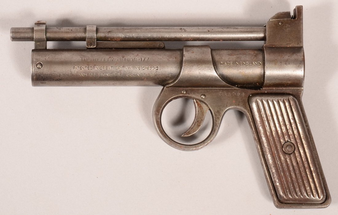 Vintage Webley & Scott "JUNIOR" (prewar?) air pistol sn: Vintage Webley & Scott "JUNIOR" (prewar?) air pistol sn J-11094 having a .177 caliber 6-1/2" barrel and ribbed steel grips. Condition: good with smooth grey patina overall.