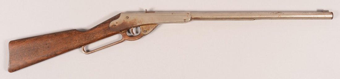 Daisy nickel plated 1,000 shot Model 27 lever action: Daisy nickel plated 1,000 shot Model 27 lever action air rifle having a cast iron lever and wood stock. Condition: 80-90% frame and barrel nickel, 10% lever nckel with rust, good stock with several sh