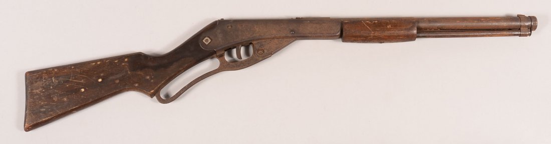 Daisy No. 108 model 39 lever action carbine having a: Daisy No. 108 model 39 lever action carbine having a wood stock, smooth forearm, and a curved cast iron lever. Condition: light rust over all the blue, good stock with initials carved in the left side