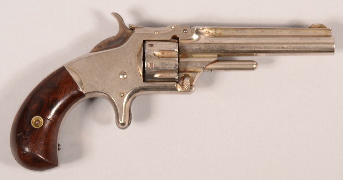 Smith & Wesson No.1, 3rd Issue nickel plated revolver: Smith & Wesson No.1, 3rd Issue nickel plated revolver with wood grips, 22 rimfire 3-1/8" barrel with markings on top of the rib, serial number 99708, assembly number 1E, with matching barrel, cylinder