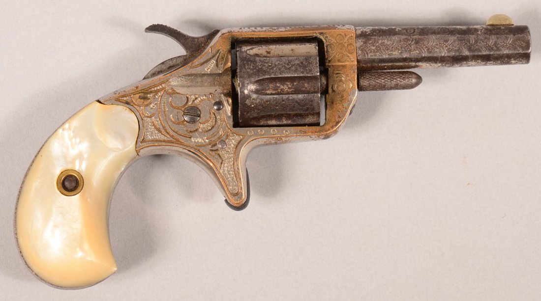 Engraved nickel plated Colt New Line 2nd model 22: Engraved nickel plated Colt New Line 2nd model 22 rimfire revolver with mother-of-pearl grips, 2-1/4" barrel, serial number 27724 with long cylinder flutes. Condition: 60-70% nickel on the frame, 10-2