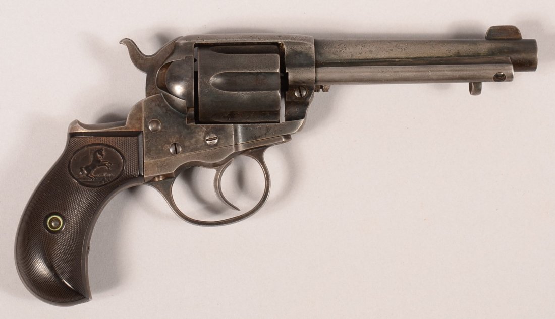 CR. Colt model 1877 Lightning double action revolver: CR. Colt model 1877 Lightning double action revolver having a 38 caliber 4-1/2" blued barrel with extractor, case colored frame serial number 123212 (made 1901) with matching trigger guard and blackst