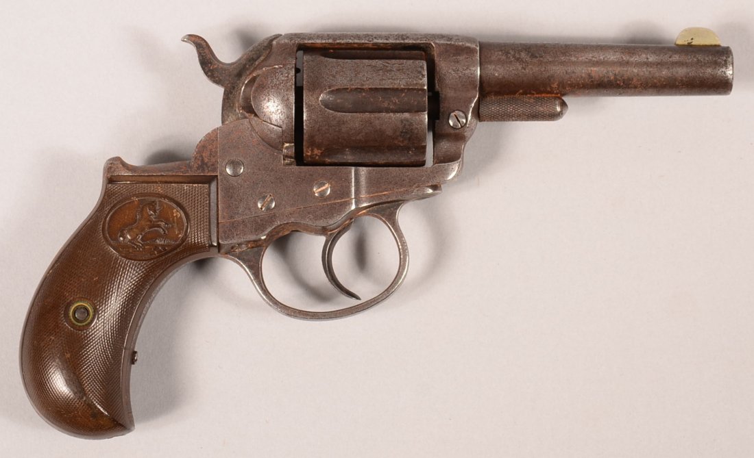 Colt model 1877 Lightning double action revolver having: Colt model 1877 Lightning double action revolver having a 38 caliber 3-1/2" blued barrel made without extractor, serial number 35116 (made 1882) with matching triggerguard and blackstrap. The grips ar