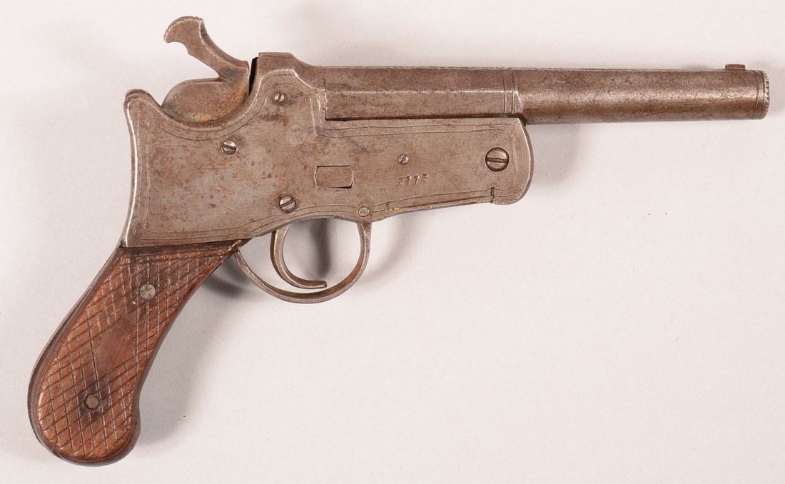 CR. Central Asian "Khyber Pass" single shot tip up: CR. Central Asian "Khyber Pass" single shot tip up pistol having a 32 caliber 5-3/4" octagon to round barrel, serial number 5115 with checkered wood grips. Condition: good.