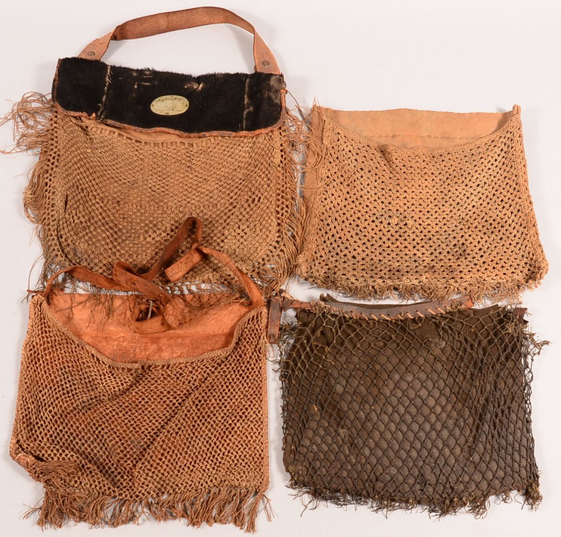 Lot of (4) vintage game pouches having netting on the: Lot of (4) vintage game pouches having netting on the front, (1) having a fur covered flap with silver oval "Sup't. John S. Den, Presented by the Tame Duch Squad". Condition: the presentation pouch is
