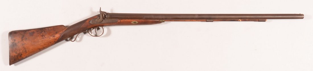 Heavy double barrel SxS percussion shotgun having 10: Heavy double barrel SxS percussion shotgun having 10 gauge 32-1/2" barrels and engraved locks. Condition: light rust overall, sound stock, working order. Left hammer spur is broken off.