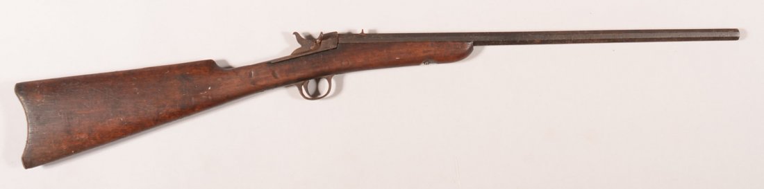 CR. Scarce Neumann Freres Bull's Eye rolling block: CR. Scarce Neumann Freres Bull's Eye rolling block rifle having a 22 rf 20-1/2" octagon barrel, sn 1740 with the buttstock having a faint Bull's Eye monogram on the left side. Condition: fair. The met