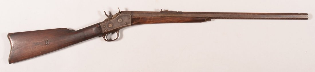 Remington rolling block model 1-1/2 Sporting rifle: Remington rolling block model 1-1/2 Sporting rifle having a 32 rf 26" heavy octagon barrel 7/8" wide at the muzzle, sn 10387. Condition: good. Much original blue shows under speckling overall on the b
