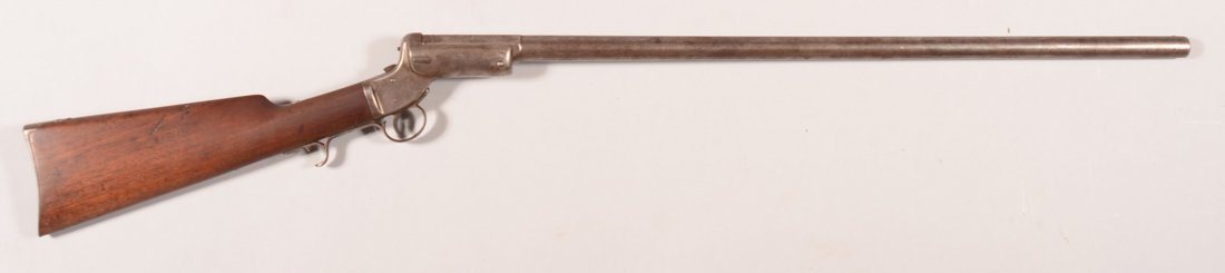 Stevens Tip-up model shotgun having a 12 gauge 30": Stevens Tip-up model shotgun having a 12 gauge 30" damascus barrel made without a forearm, sn 6048. Condition: steel grey patina on the metal with vivid twist lines on the barrel, sound stock. The ham