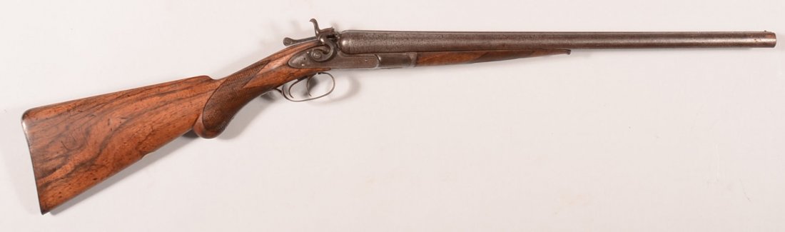 Colt model 1878 double barrel SxS shotgun having 12: Colt model 1878 double barrel SxS shotgun having 12 gauge damascus barrels shortened to 21-7/8". It has a low serial number of 265 with matching barrels, forearm, and triggerguard. Condition: smooth b