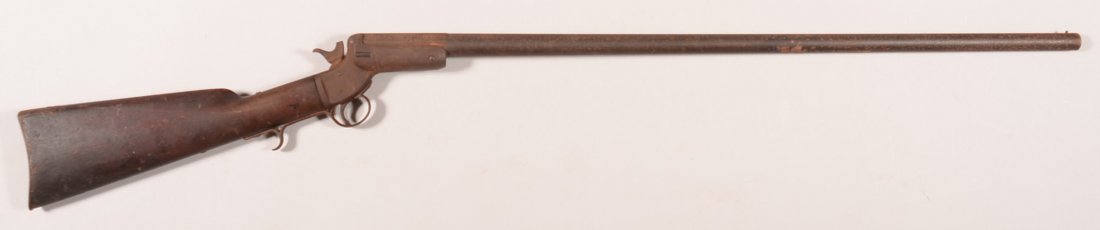 Stevens Tip-up model shotgun having a 12 gauge 32": Stevens Tip-up model shotgun having a 12 gauge 32" barrel made without a forearm, sn 885, matching barrel. Condition: dark untouched patina with some roughness on the metal, sound stock, working order