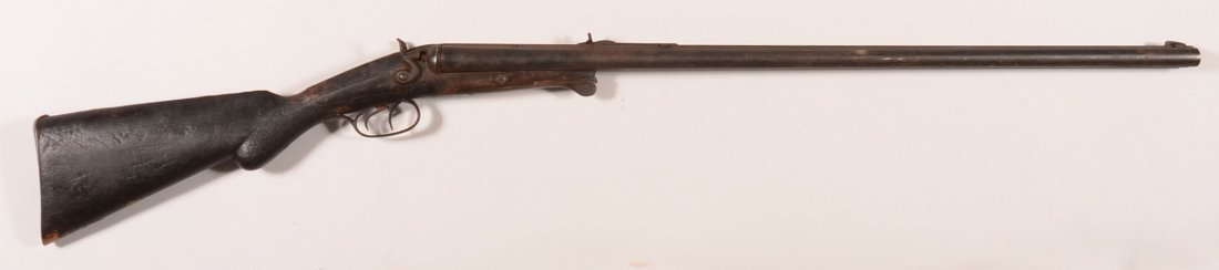 W. Richards hammer type double barrel SxS rifle/shotgun: W. Richards hammer type double barrel SxS rifle/shotgun having a 38 caliber rifle and a 12 gauge shotgun with back action locks and under lever opening mechanism. Condition: dark patina overall with s