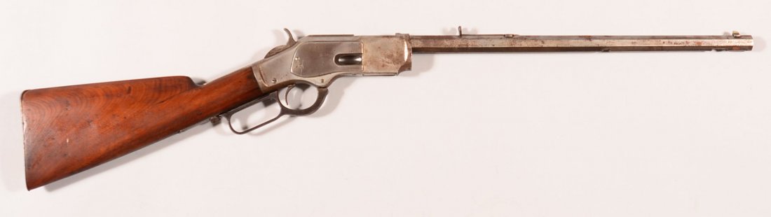 Winchester model 1873 lever action rifle having a 32-20: Winchester model 1873 lever action rifle having a 32-20 caliber octagon barrel shortened to 18", sn 284925 (made 1889). Condition: the barrel has been shortened, the magazine tube and sliding dust cov