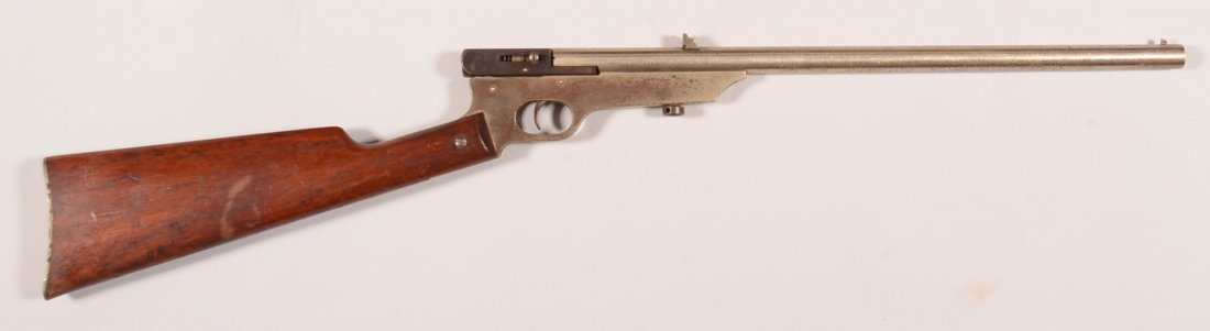 CR. Quackenbush Safety Cartridge side swivel breech: CR. Quackenbush Safety Cartridge side swivel breech rifle having a 22 caliber 18" nickel plated barrel, no serial number, nickel plated frame, blued breech. Condition: 95-98% nickel on barrel with bub
