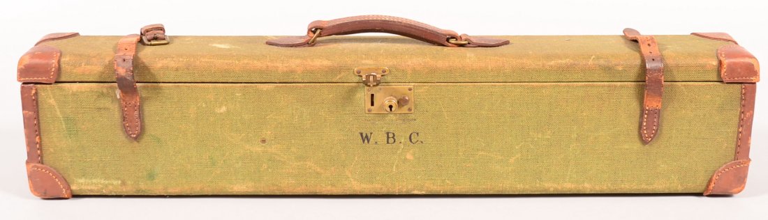 Vintage James Purdey & Sons labeled green fabric: Vintage James Purdey & Sons labeled green fabric wrapped luggage style shotgun case having their brass nameplate inside. Condition: very good with scuffed corners.