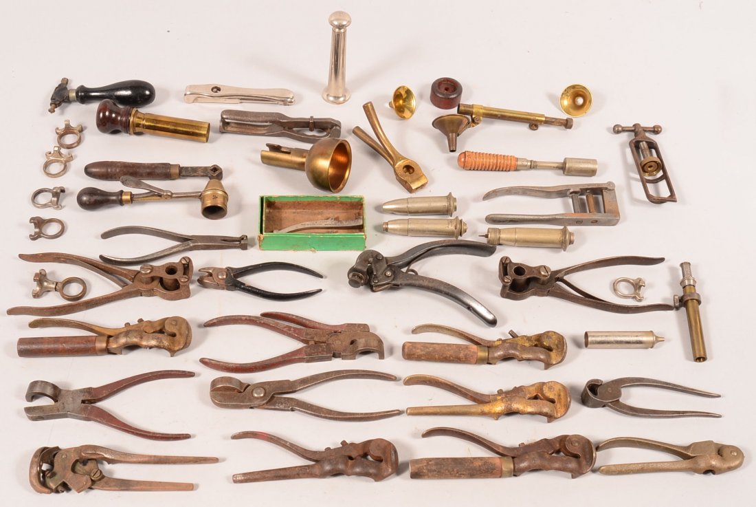 Large lot of vintage shotshell reloading implements: Large lot of vintage shotshell reloading implements including de-cappers, extractors, unusual cappers, a graduated funnel/loader, a Berdan primer hydraulic de-capper and capper, plus more. Condition: 