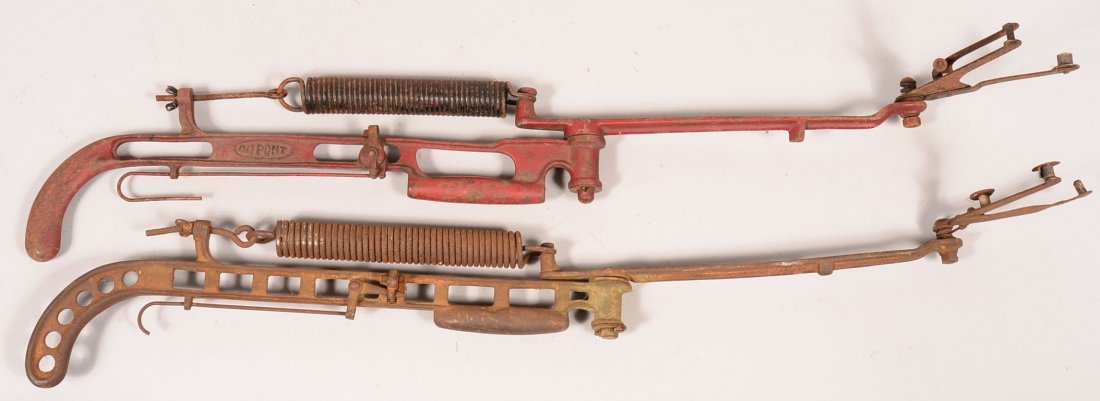 Lot of (2) malleable iron early hand held clay bird: Lot of (2) malleable iron early hand held clay bird throwers: the first is by Dupont painted red, 40" o/a. The second is unmarked but of very similar design as the Dupont with the frame having more li